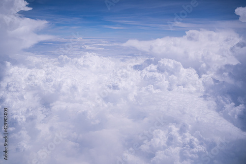 Fototapeta Naklejka Na Ścianę i Meble -  Atmosphere beautiful blue sky with clouds form plane. Flying above the clouds. Clouds blue sky High angle air. Background Clouds. A view from airplane window. View along the way.
