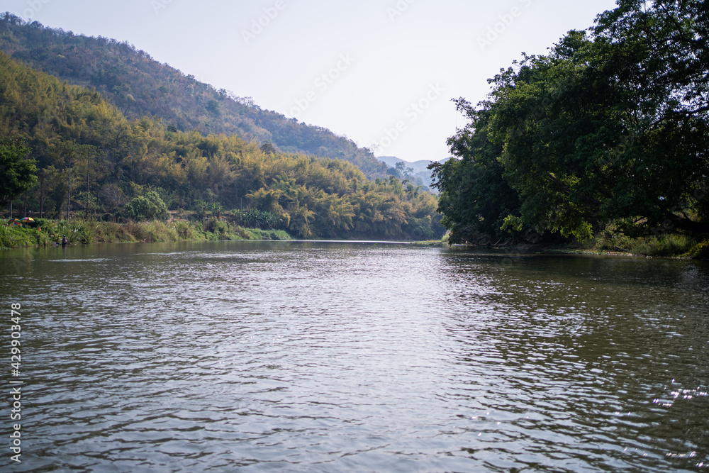 Mountain views and the Kok River in Thailand,view of the mountain landscape with Kok river a river flowing  its way across Chiang Rai province to Mekong river.