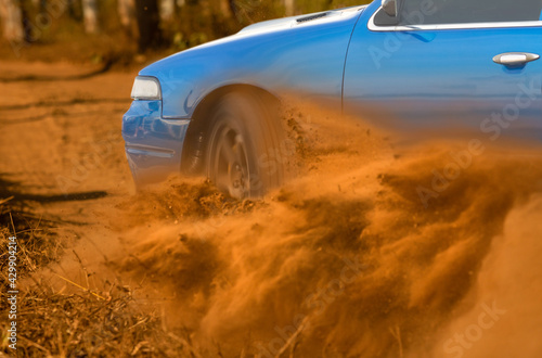 Fototapeta Naklejka Na Ścianę i Meble -  Rally race car drifting on dirt track.