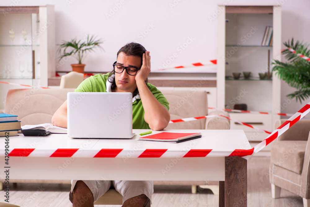 Young male student studying at home in self-isolation concept Young male student studying at home in self-isolation concept