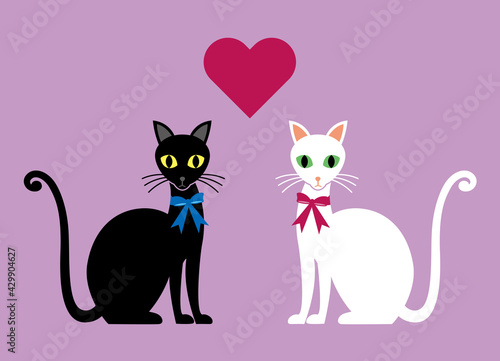 There's a heart between a black cat and a white cat