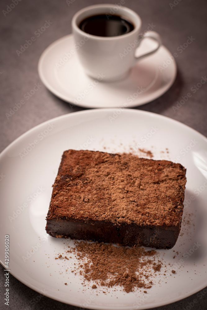 brownie with chocolate powder and coffee