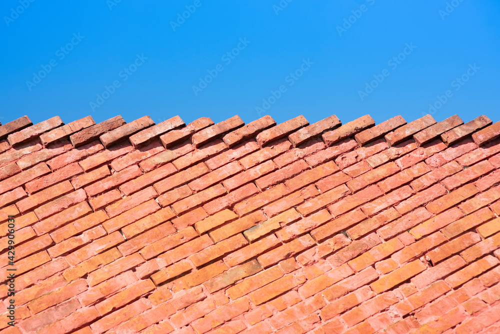 Red brick wall as stairs and the blue sky Red brick wall as stairs and the blue sky