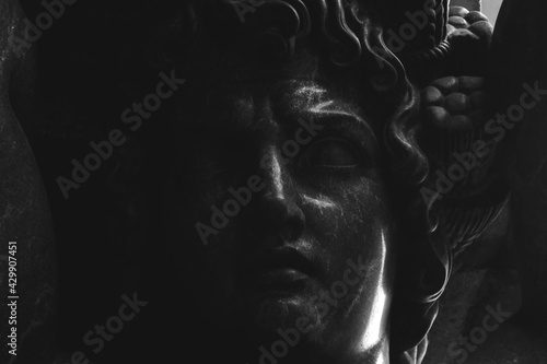 sculpture titan atlant. face close up photo