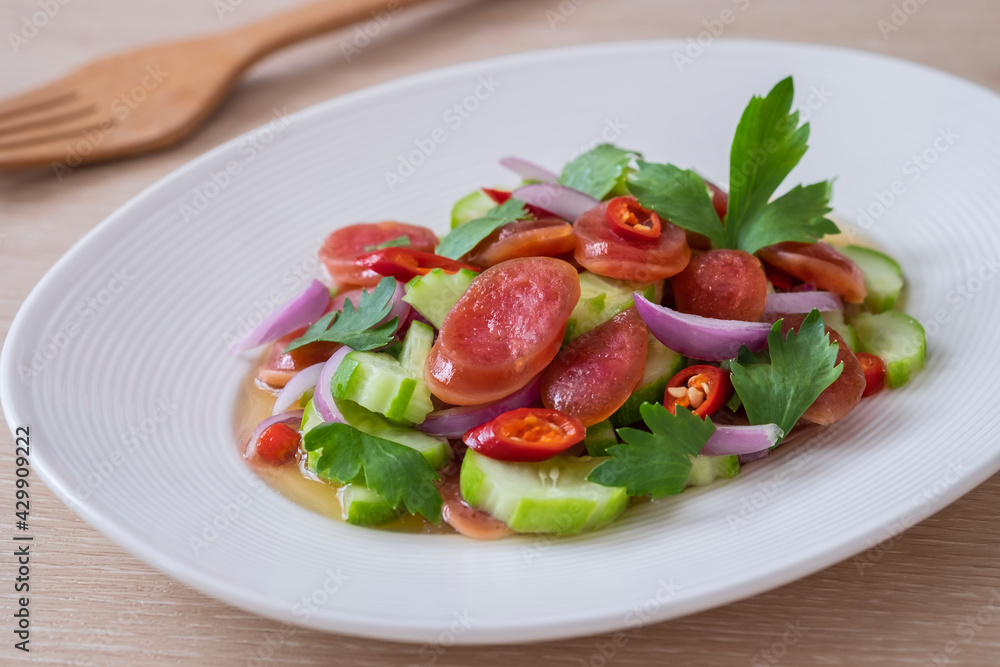 Spicy chinese pork sausage salad on plate, Thai food Spicy chinese pork sausage salad on plate, Thai food