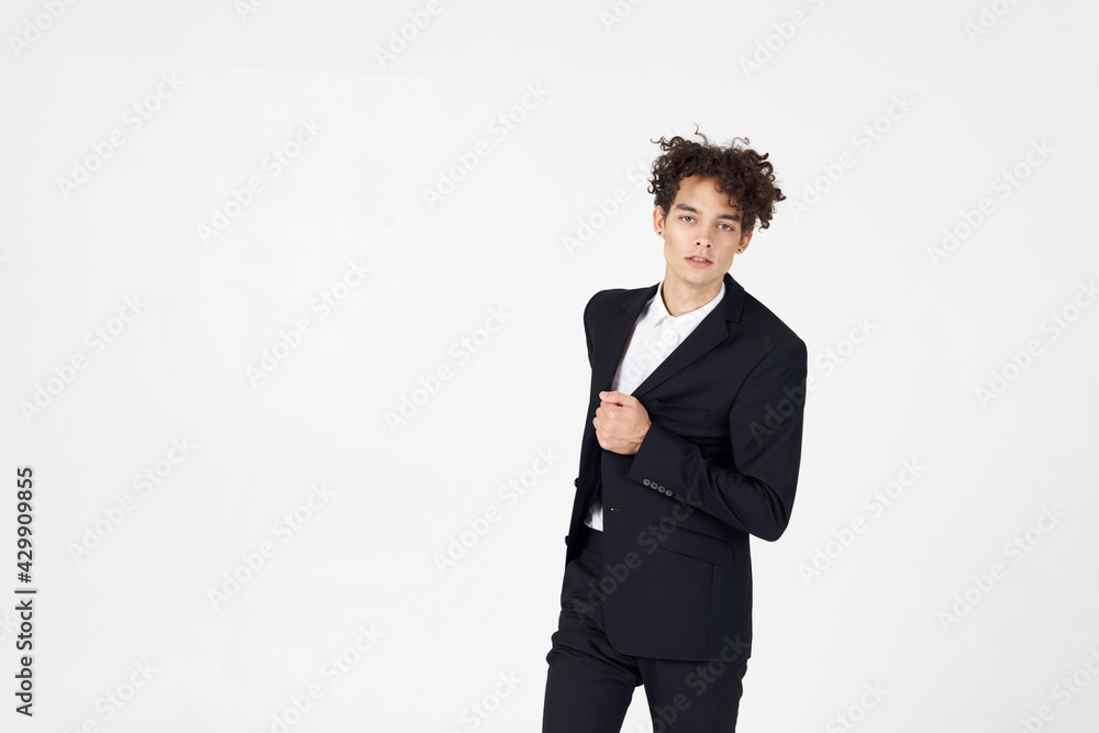 handsome guy with curly hair and in a jacket shirt pants model handsome guy with curly hair and in a jacket shirt pants model