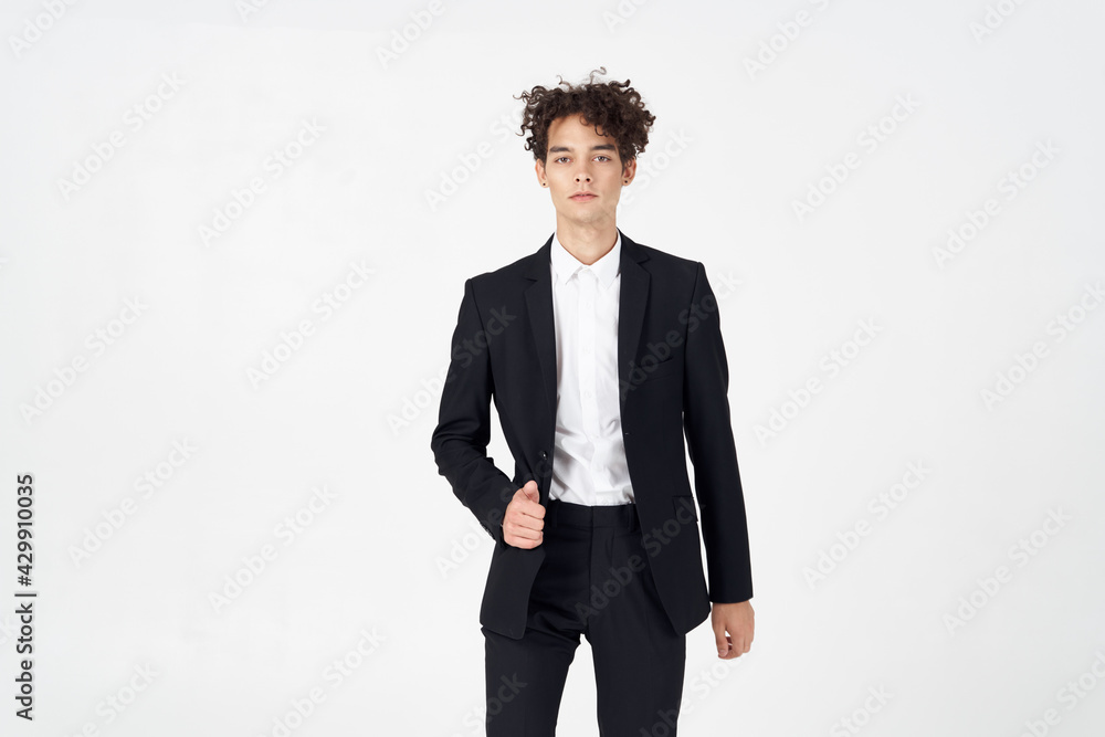 handsome guy with curly hair and in a jacket shirt pants model handsome guy with curly hair and in a jacket shirt pants model