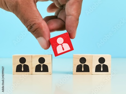 Human resource management and recruitment concept. Choosing good employee leader. Man choose and take wooden cube.