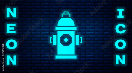 Glowing neon Fire hydrant icon isolated on brick wall background. Vector