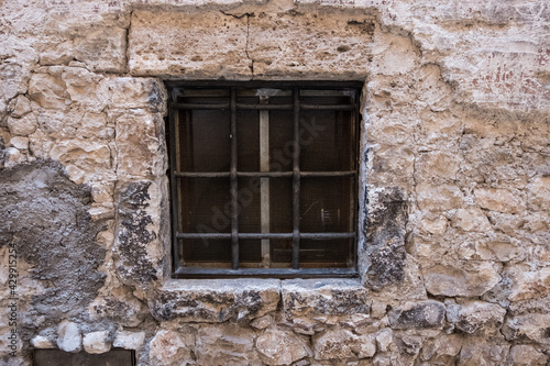 Old vintage window on an ancient facade. No people