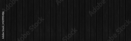 Panorama of Vintage old black wooden fence texture and background seamless
