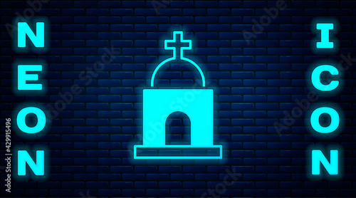 Glowing neon Old crypt icon isolated on brick wall background. Cemetery symbol. Ossuary or crypt for burial of deceased. Vector