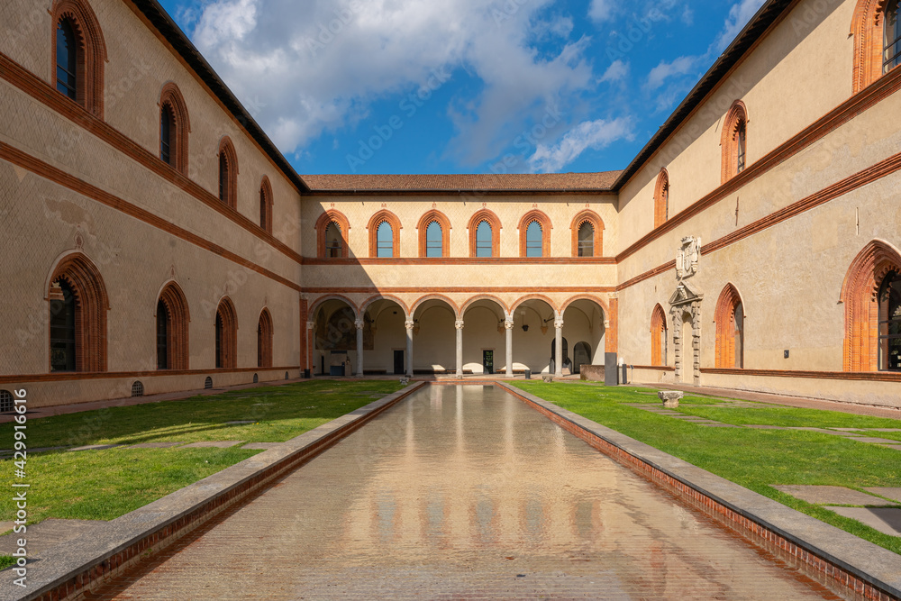 Amazing inner courtyard of the Sforzesco castle,sunny day and clouds, Milan,Italy