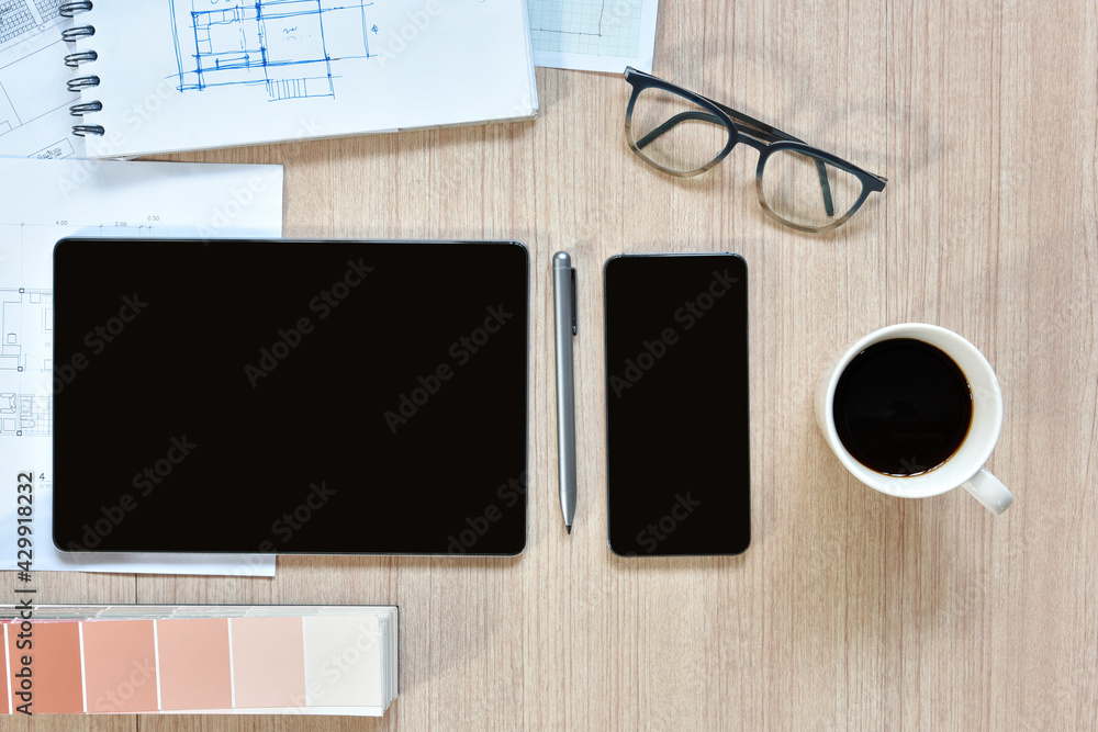 a top view of architect working desk with equipment for drawings pens sketched idea on wood table, the concept of modern technology for architectural working with tablet a top view of architect working desk with equipment for drawings pens sketched idea on wood table, the concept of modern technology for architectural working with tablet