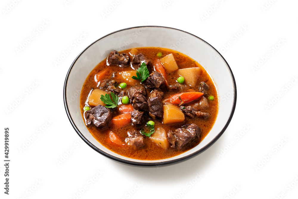 Irish stew made with beef, potatoes, carrots and herbs. Traditional St patrick's day dish. isolated on white background Irish stew made with beef, potatoes, carrots and herbs. Traditional St patrick's day dish. isolated on white background
