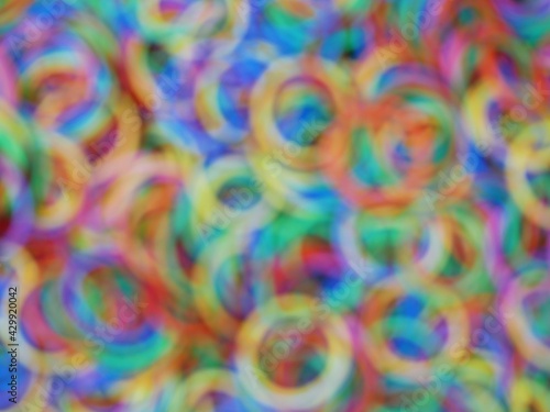 Multiple circles of rainbow bokeh photo.