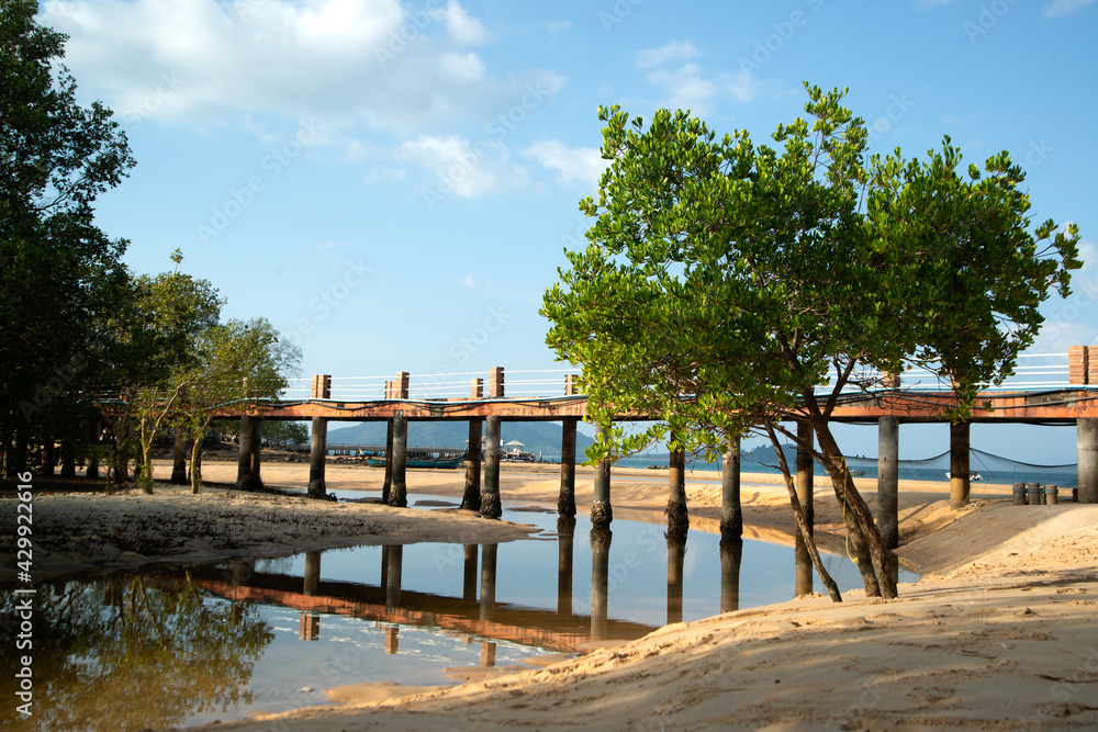 Concrete bridge used as a footpath and transportation  on the beach on Koh Phayam in Southern of Thailand.