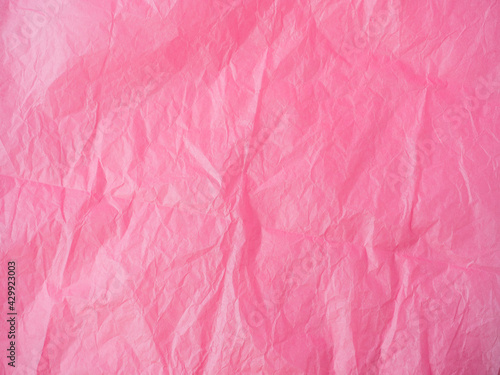 The texture of crumpled paper is maroon. top view, copy space. color background