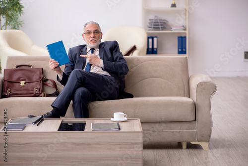 Old businessman employee waiting for business meeting