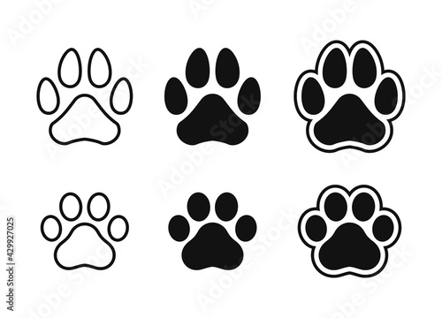 Silhouette of cat and dog paw print.
