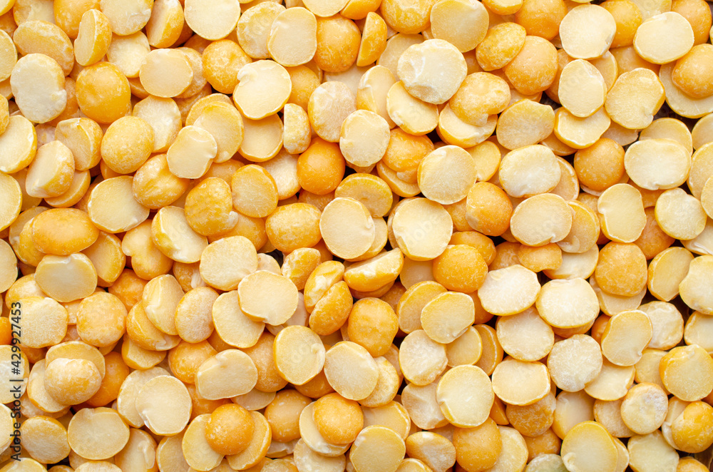 Dry organic split yellow mung bean background, read for clean food ingredient cooking or agricultural product concept Dry organic split yellow mung bean background, read for clean food ingredient cooking or agricultural product concept