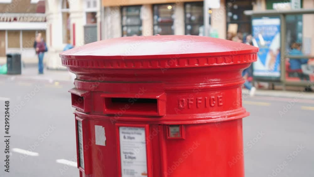 Red mailbox in London city street in 4k slow motion 60fps Red mailbox in London city street in 4k slow motion 60fps