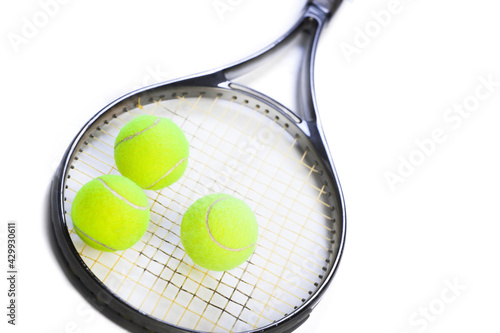tennis racket with yellow balls on white background. Sport concept.