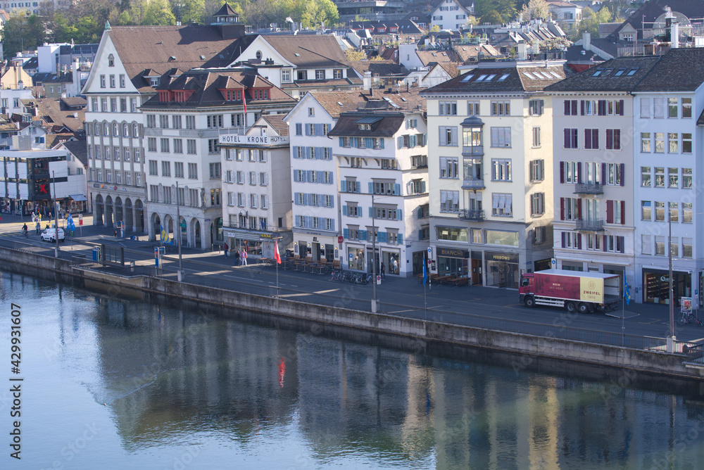 Limmatquai at the old town of Zurich with medieval houses and river Limmat in the foreground. Photo taken April 21st, 2021, Zurich, Switzerland.