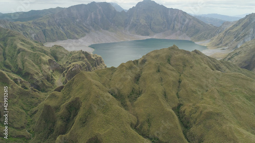 Crater lake of the volcano Pinatubo among the mountains, Philippines, Luzon. Aerial view beautiful landscape at Pinatubo mountain crater lake. Travel concept photo