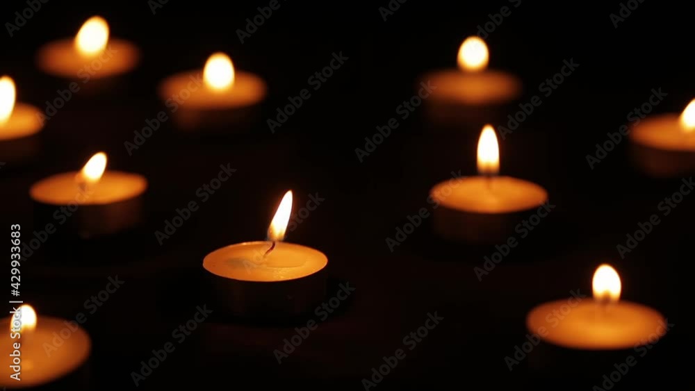 Ten candles light up dark night and their flames sway in the wind. Ten candles light up dark night and their flames sway in the wind.