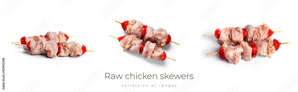 Raw chicken skewers with cherry tomatos isolated on a white background. Souvlaki isolated.