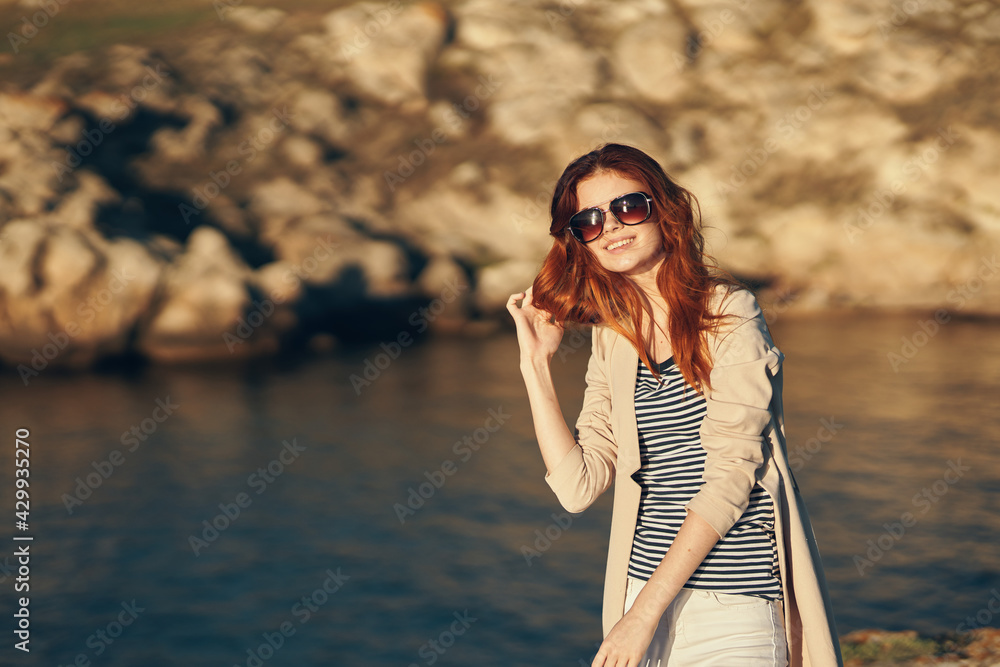traveler on vacation in the mountains outdoors near the sea gesturing with her hands cropped view traveler on vacation in the mountains outdoors near the sea gesturing with her hands cropped view