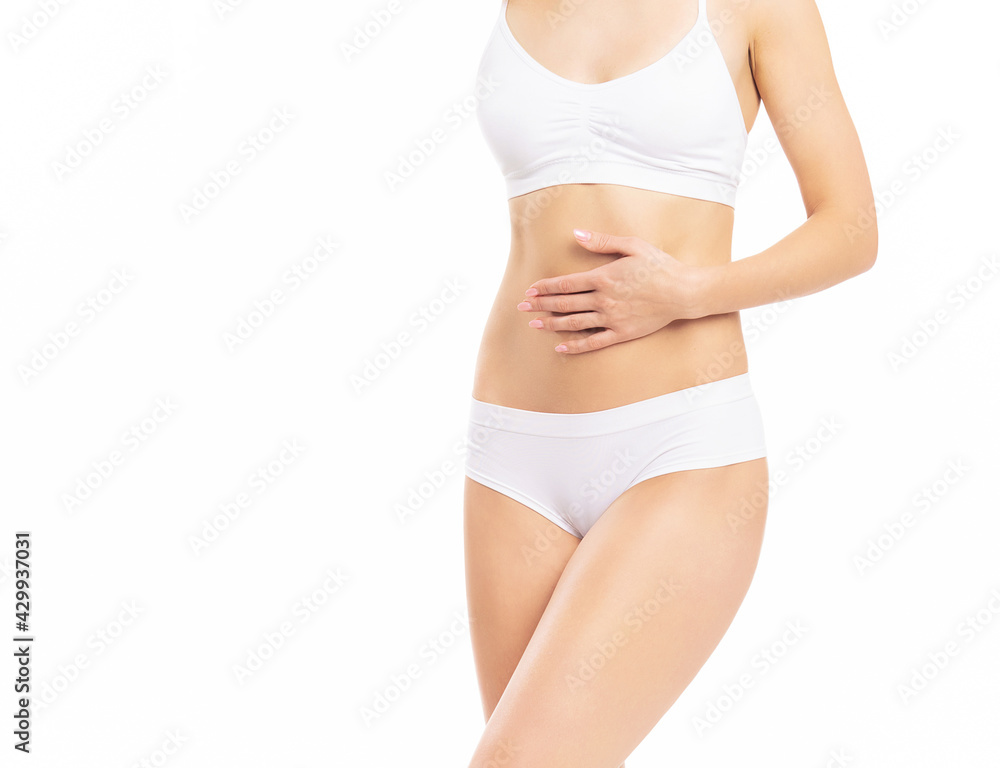 Close-up of a beautiful and fit female figure. Studio photo of young woman's body in swimsuit.