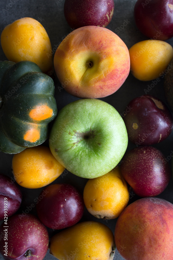 Fresh seasonal fruits and vegetables close up photo. Vibrant colors of raw ingredients. Healthy eating concept. Fresh seasonal fruits and vegetables close up photo. Vibrant colors of raw ingredients. Healthy eating concept.