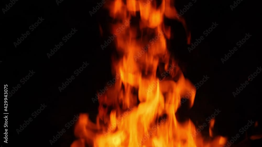 In the dark night, a huge fire burning, and the flames flying up into the sky In the dark night, a huge fire burning, and the flames flying up into the sky
