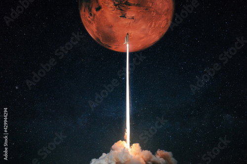 Fototapeta Rocket with blast and smoke takes off to the red planet mars mars, concept