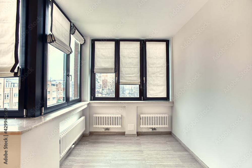 Empty white room interior with roman vertical curtains and parquet floor Empty white room interior with roman vertical curtains and parquet floor