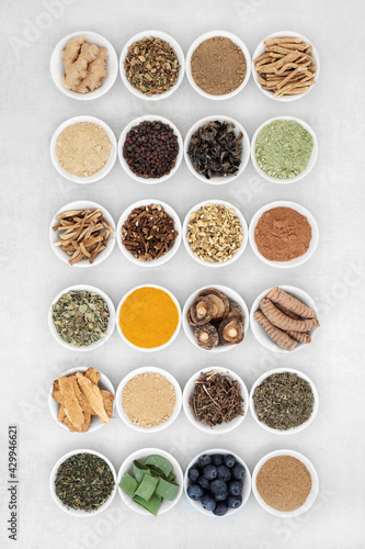 Adaptogen healthy food with fruit, herb, spices and supplement powders. Natural plant based foods that help the body deal with stress and promote or restore normal physiological functions. Top view.