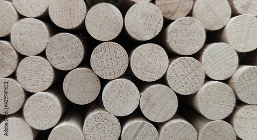 Cylindrical wooden slats. Ligth background