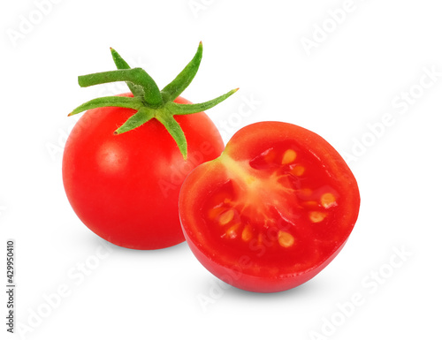 Whole and half tomatoes isolated on white background.