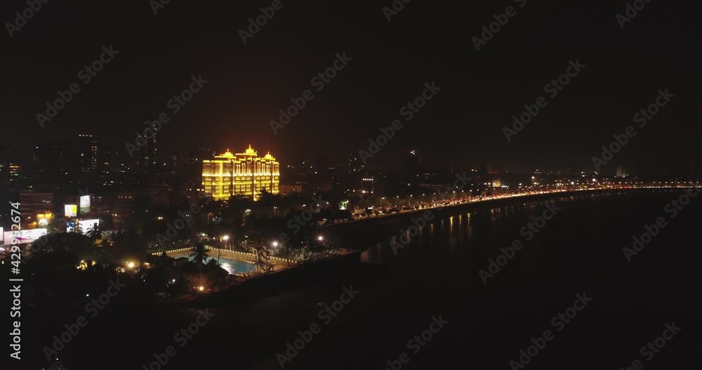 An aerial view with cinematic drone movement of the iconic Marine Drive nightlife with Air India and Trident Hotel buildings in sight. An aerial view with cinematic drone movement of the iconic Marine Drive nightlife with Air India and Trident Hotel buildings in sight.