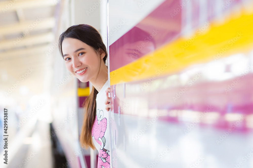 Asian beautiful woman say hello to her family due to working in the city by train or she arrive say welcome to home at the station. Asian beautiful woman say hello to her family due to working in the city by train or she arrive say welcome to home at the station.