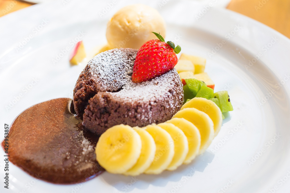A dessert dish call chocolate lava, include vanilla ice cream, banana, kiwi and apple. This sweet is made from cocoa seed. Good combination between chocolate cake, cold ice cream and fruits. A dessert dish call chocolate lava, include vanilla ice cream, banana, kiwi and apple. This sweet is made from cocoa seed. Good combination between chocolate cake, cold ice cream and fruits.