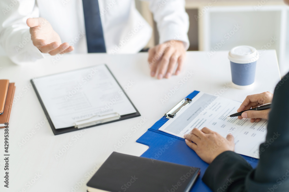 Successful job interview, Recruiter or manager and job candidate with resume in office. Successful job interview, Recruiter or manager and job candidate with resume in office.