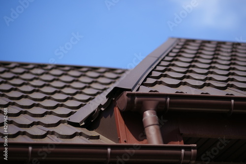 Close-up of brown tiled roof in sunny spring day