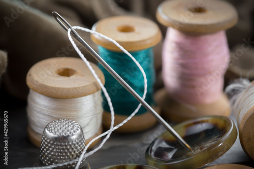 Threads, needles and sewing items.