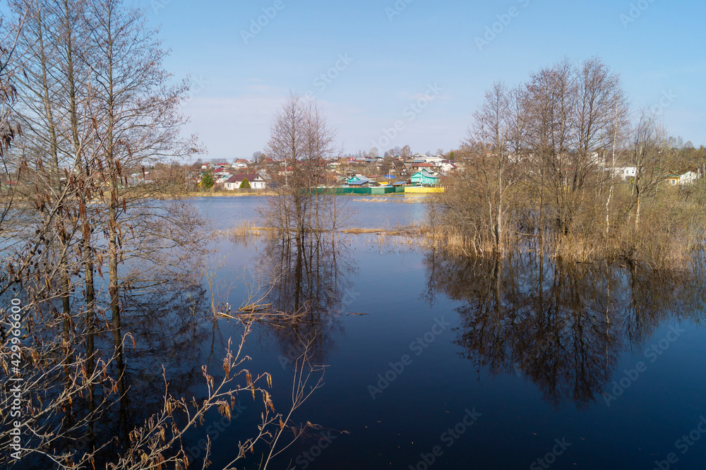 Spring flood in the countryside on a sunny day Spring flood in the countryside on a sunny day