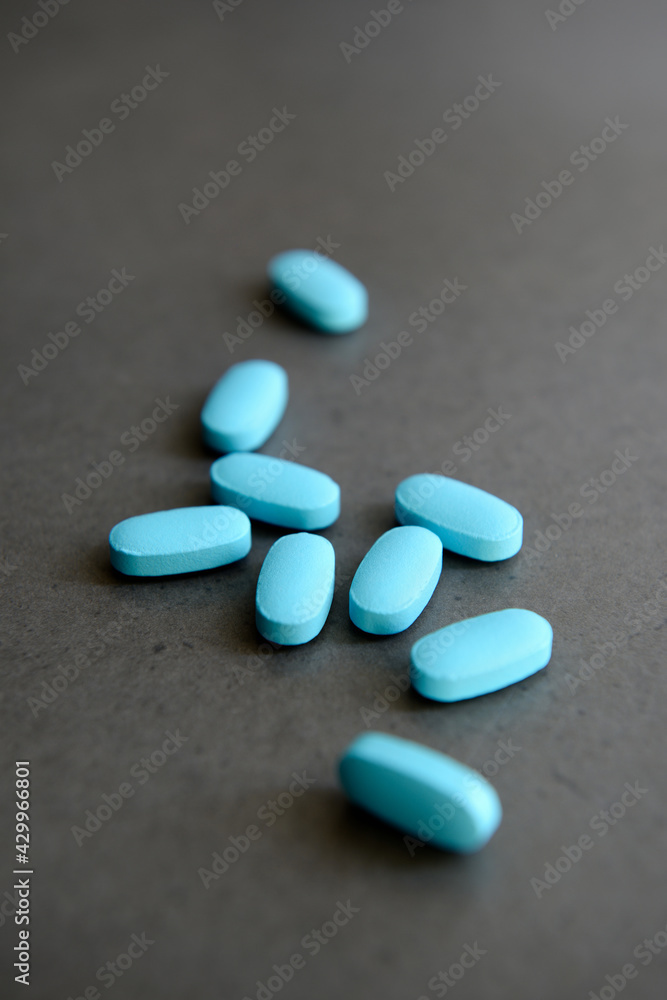 Pharmaceutical medicine pills over dark background Pharmaceutical medicine pills over dark background