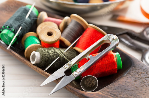 Threads, needles and sewing items. photo