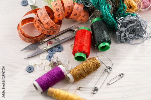 Threads, needles and sewing items.